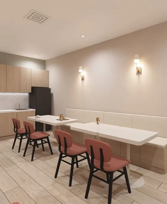 Staff lounge with kitchen and banquette seating